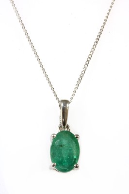 Lot 150 - A white gold single stone emerald pendant