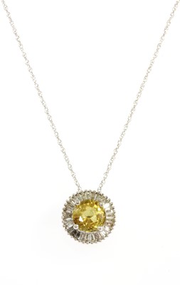 Lot 206 - A white gold yellow sapphire and diamond cluster pendant