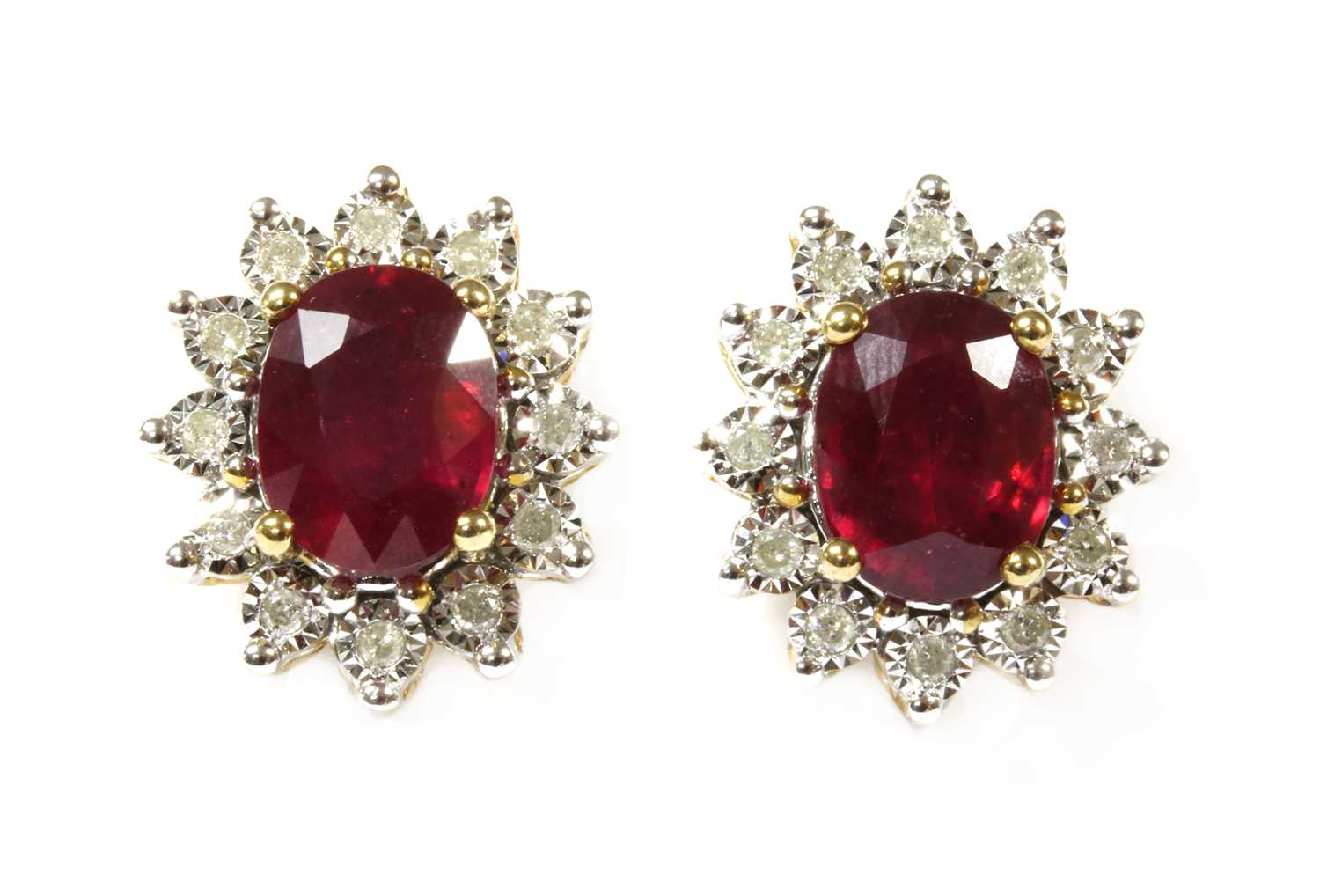 Lot 40 - A pair of gold ruby and diamond cluster earrings