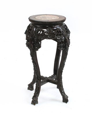 Lot 722 - A Chinese hardwood jardiniere stand