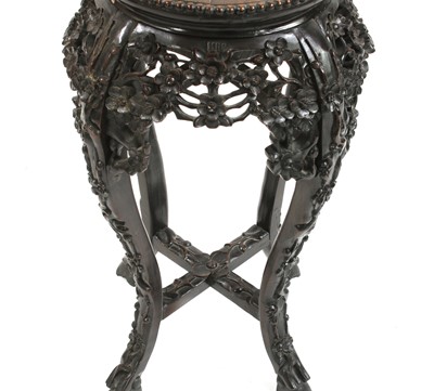 Lot 722 - A Chinese hardwood jardiniere stand