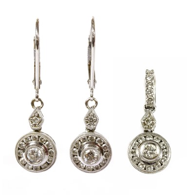 Lot 167 - A white gold diamond cluster pendant and earrings suite