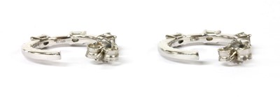 Lot 172 - A pair of white gold diamond hoop earrings