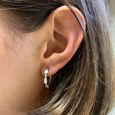 Lot 172 - A pair of white gold diamond hoop earrings