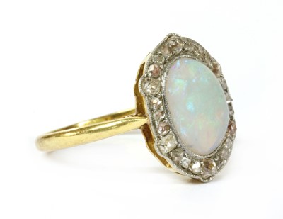 Lot 15 - A gold opal and diamond ring