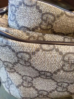 Lot 35 - A Gucci beige coated canvas shoulder bag
