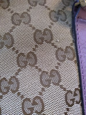 Lot 40 - A Gucci beige monogrammed canvas medium 'Miss' tote