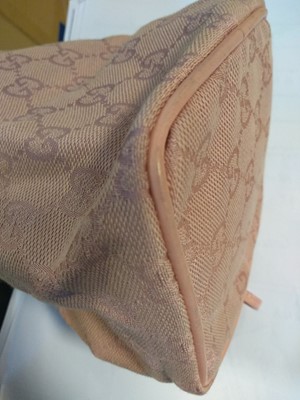 Lot 43 - A Gucci pink monogrammed canvas mini drawstring backpack