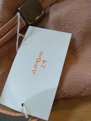 Lot 43 - A Gucci pink monogrammed canvas mini drawstring backpack