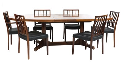 Lot 211 - A rosewood extending dining table