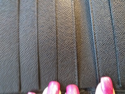 Lot 94 - A Louis Vuitton black Epi leather 'Porte-Billets 6' wallet