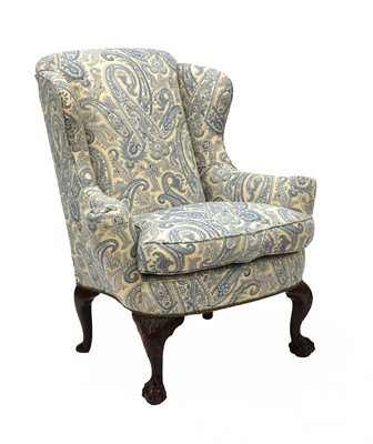 Lot 916 - A George II-style wing back armchair