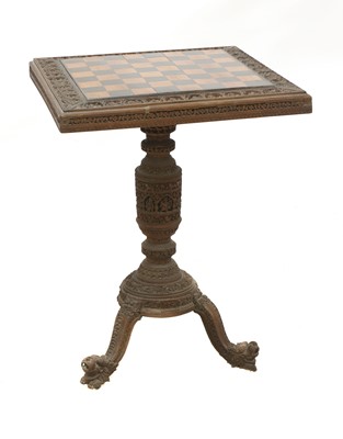 Lot 868 - An Indian carved sandalwood chess or games table