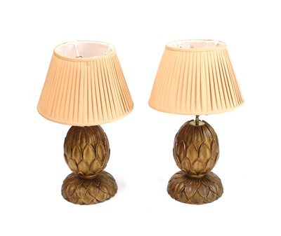 Lot 438 - A pair of carved and gesso painted pineapple table lamps