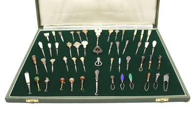 Lot 441 - A cased collection of button hooks with various handles