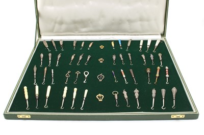 Lot 440 - A cased collection of button hooks with various handles