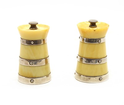 Lot 263 - A pair of ivory and silver pepper grinders