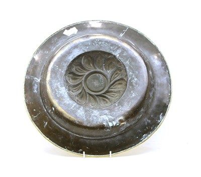 Lot 174 - A Jacobean style brass embossed alms dish