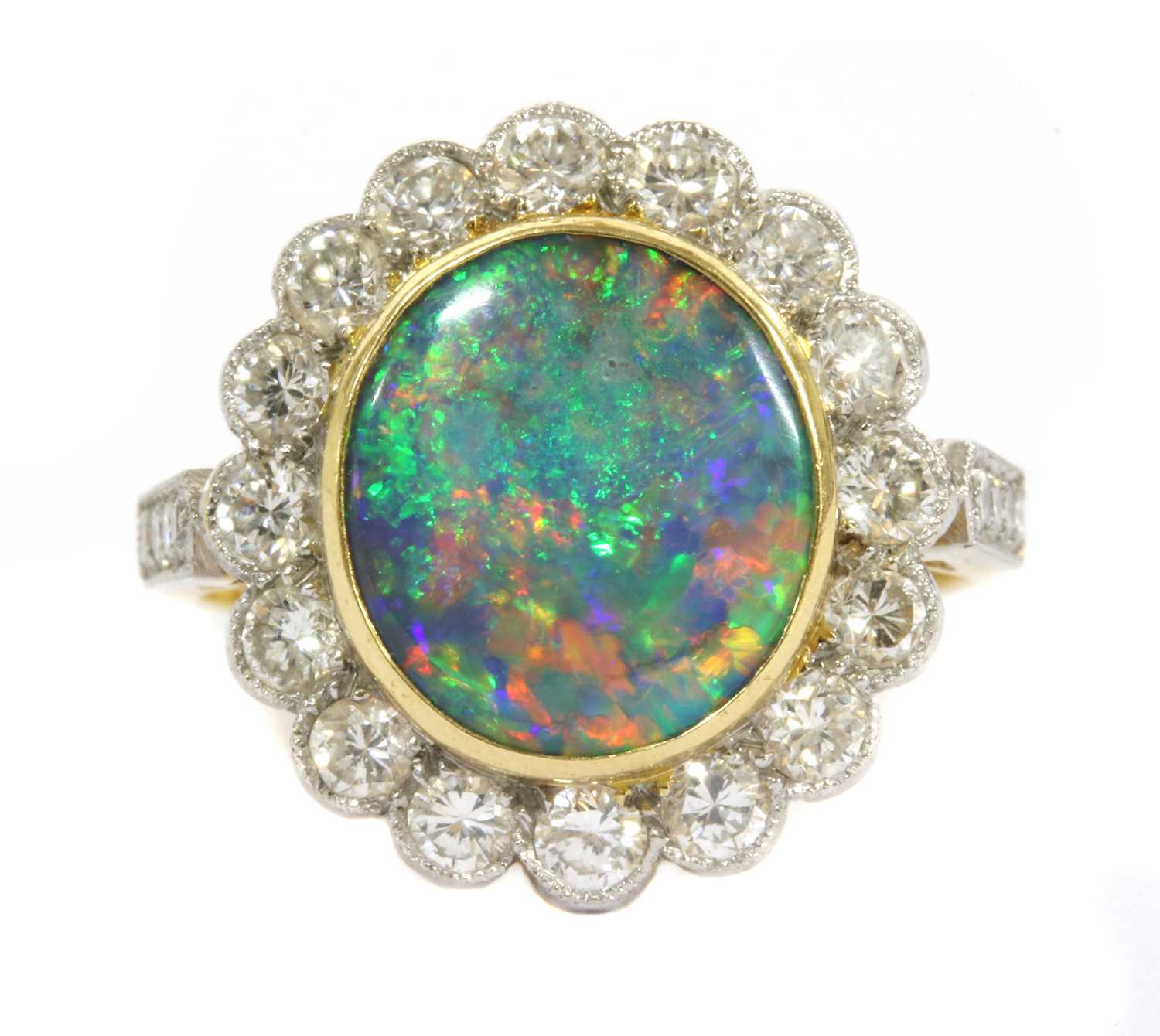 Lot 21 - A gold boulder opal and diamond cluster ring