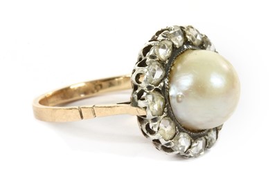 Lot 73 - A gold and silver, cultured pearl and diamond cluster ring