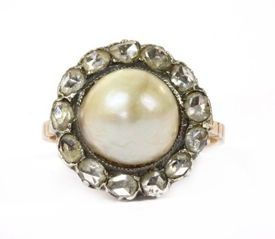 Lot 73 - A gold and silver, cultured pearl and diamond cluster ring