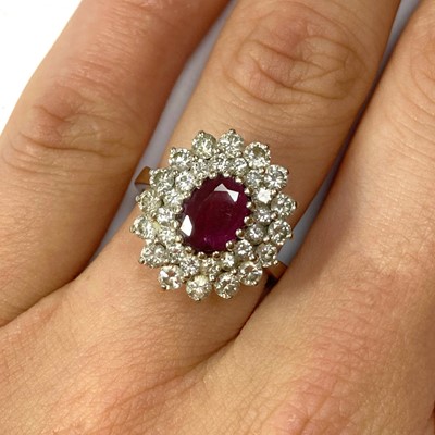 Lot 45 - A white gold ruby and diamond cluster ring
