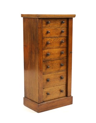 Lot 316 - An oak seven drawer wellington chest