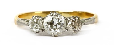 Lot 308 - A gold and platinum three stone diamond ring