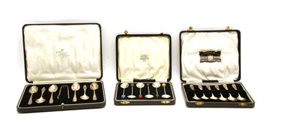 Lot 25 - Three silver cased six pieced coffee spoon sets