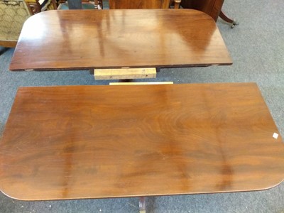 Lot 455 - A Georgian triple pillar mahogany dining table