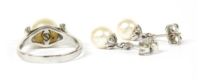 Lot 360 - A white gold cultured pearl and diamond ring