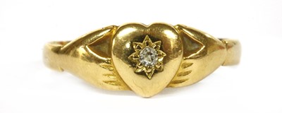 Lot 350 - A gold diamond set Claddagh style ring