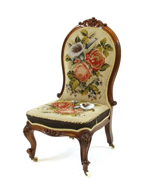 Lot 457 - A Victorian rosewood nursing chair