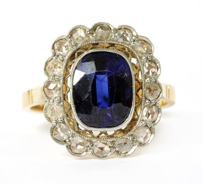 Lot 323 - An early 20th century gold synthetic sapphire and diamond cluster ring