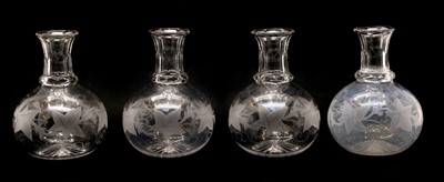 Lot 443 - A set of four cut and engraved carafes of globular form