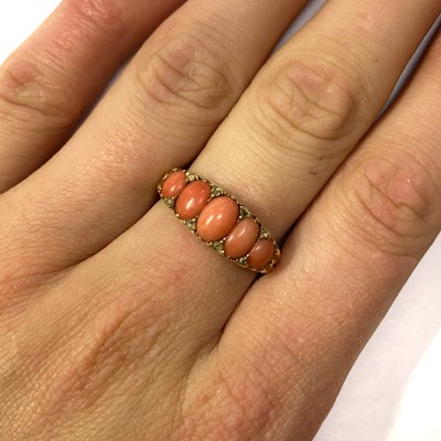 Lot 34 - A Victorian gold five stone coral and diamond ring
