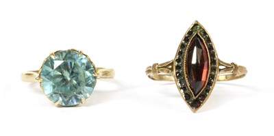 Lot 195 - A gold single stone blue zircon ring