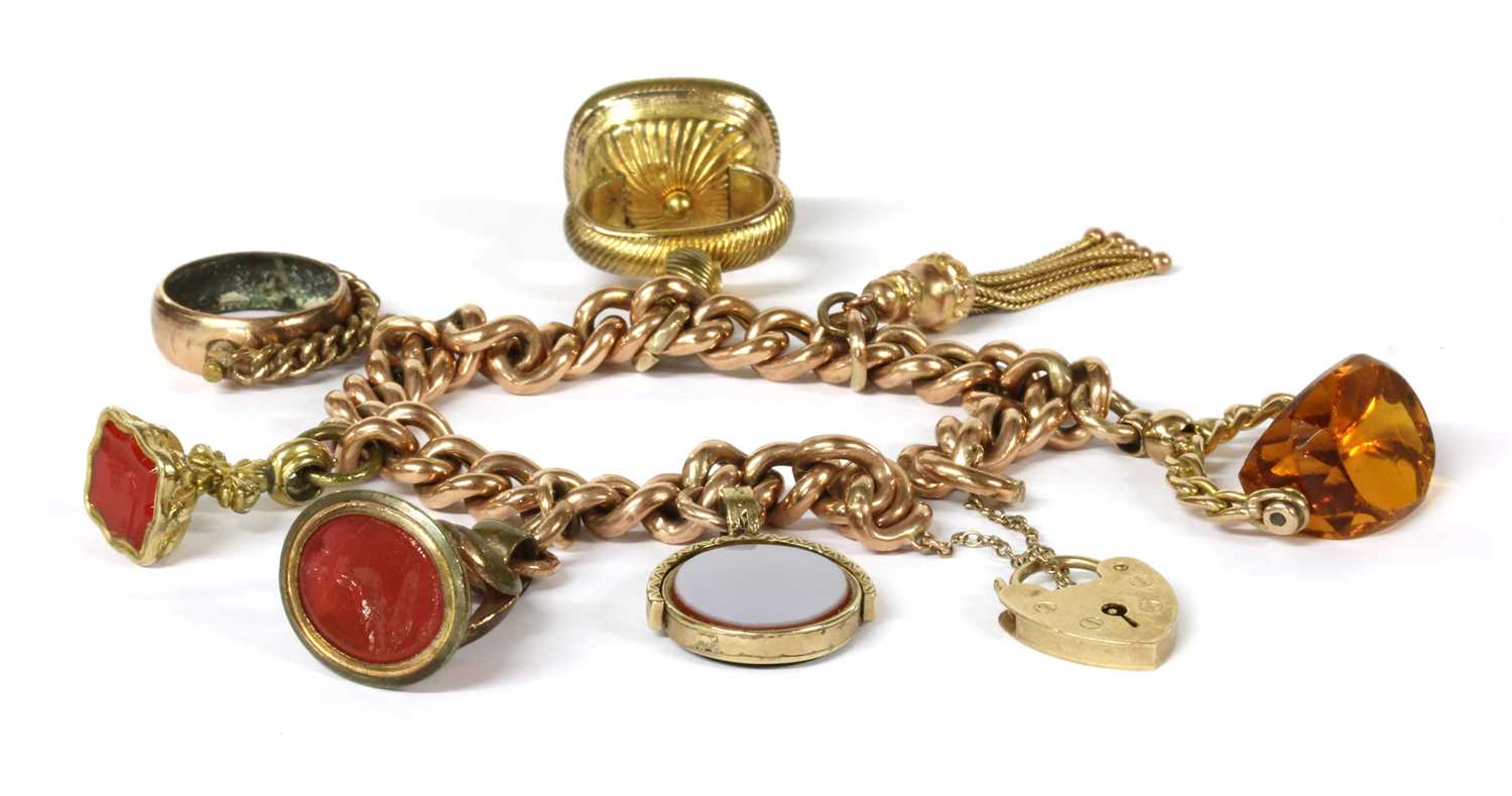Lot 75 - A gold charm bracelet