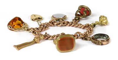 Lot 75 - A gold charm bracelet