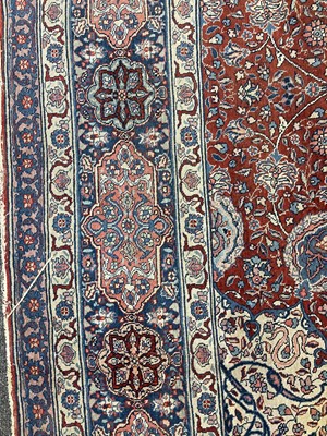 Lot 767 - A large Persian Tabriz carpet