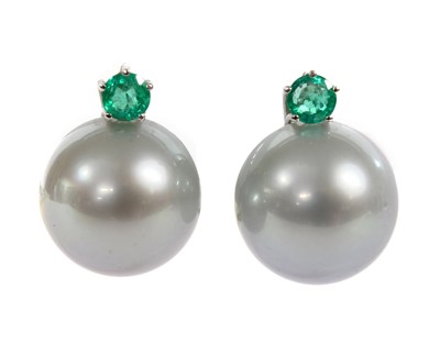 Lot 358 - A pair of white gold cultured South Sea pearl and emerald earrings