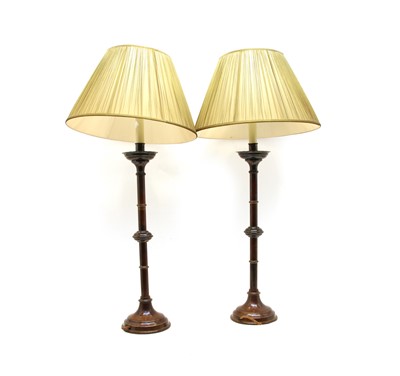 Lot 264 - A pair of bronze table table lamps with gilt bands and crenelated drip pans