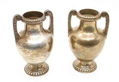 Lot 830 - A pair silver twin-handled urns