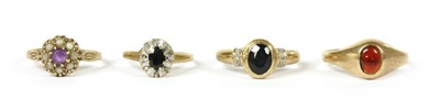 Lot 406 - Four 9ct gold rings