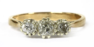 Lot 309 - A 9ct gold three stone diamond ring