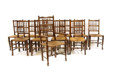 Lot 331 - Eleven rush seated oak dining chairs