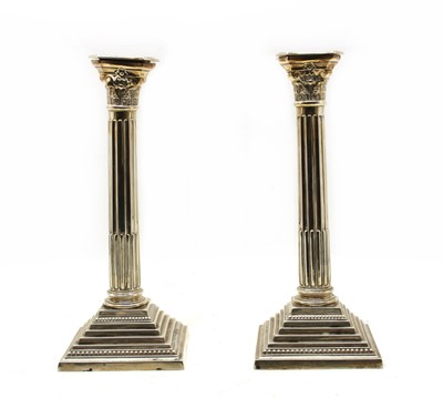 Lot 306 - A pair of George V silver classical column candlesticks