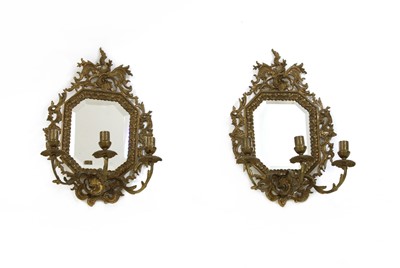 Lot 688 - A pair of rococo-style gilt brass girandoles