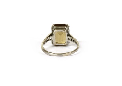Lot 140 - A platinum citrine and diamond ring