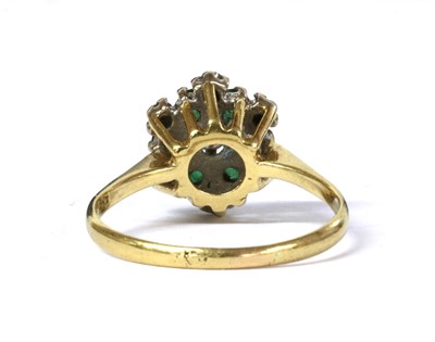 Lot 127 - An 18ct gold diamond and emerald cluster ring